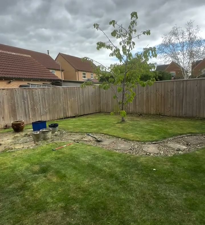 After: the Ingleby Barwick back garden with its borders cleared back to the fence, the lawn cut and the stepping-stone path showing